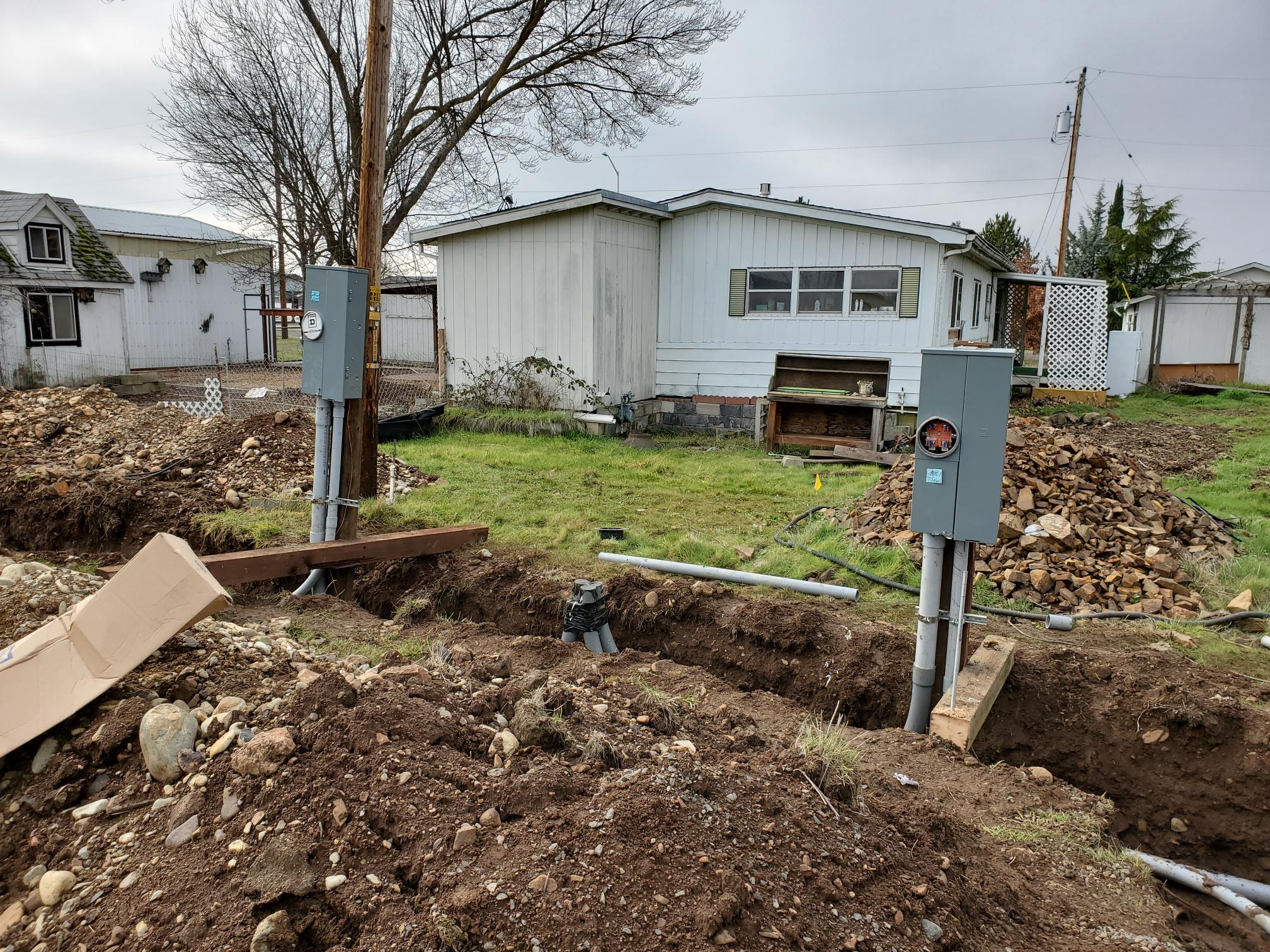 Exterior electrical service equipment and underground conduit installation