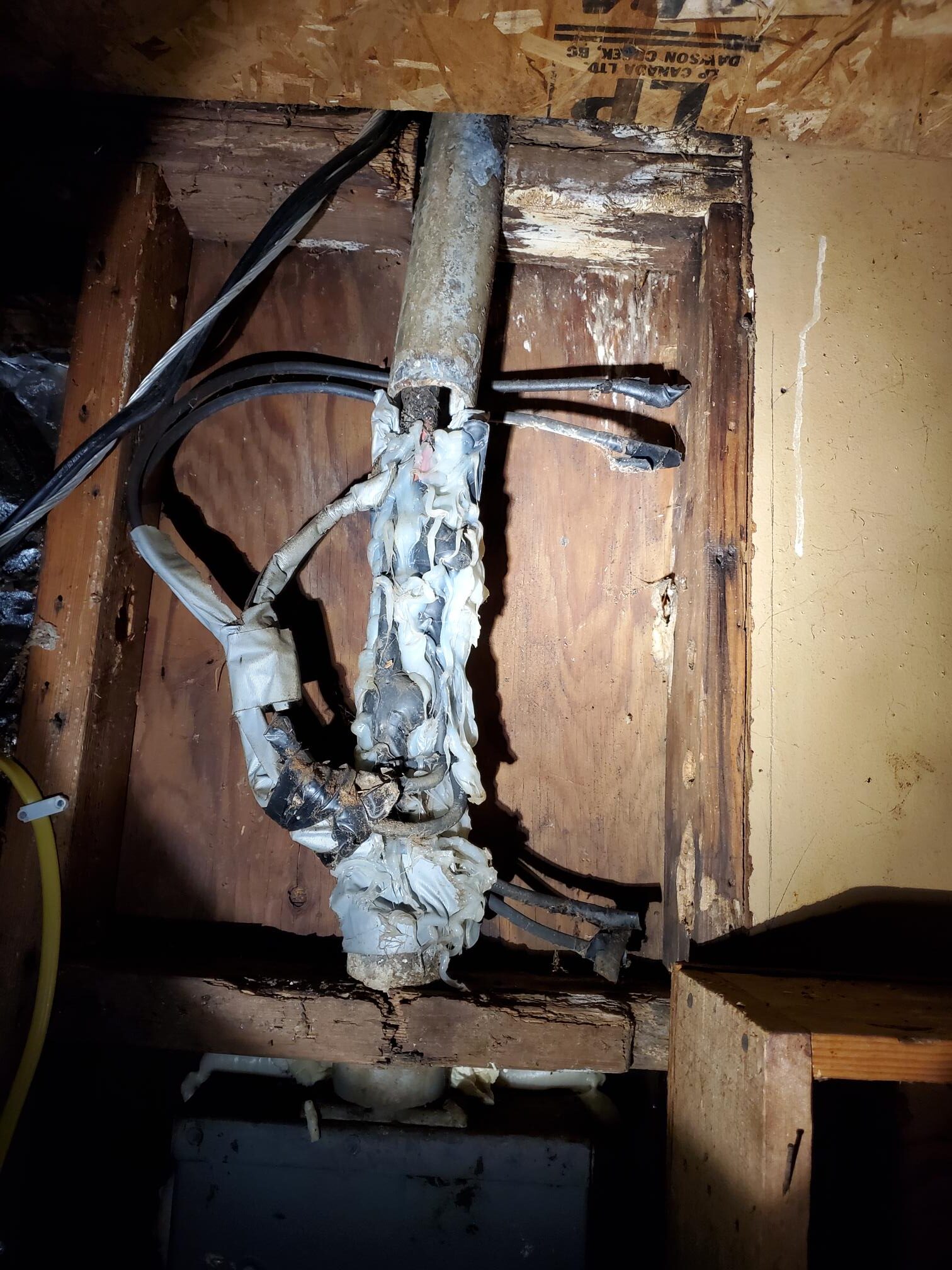 Damaged electrical wiring exposed during troubleshooting and repair